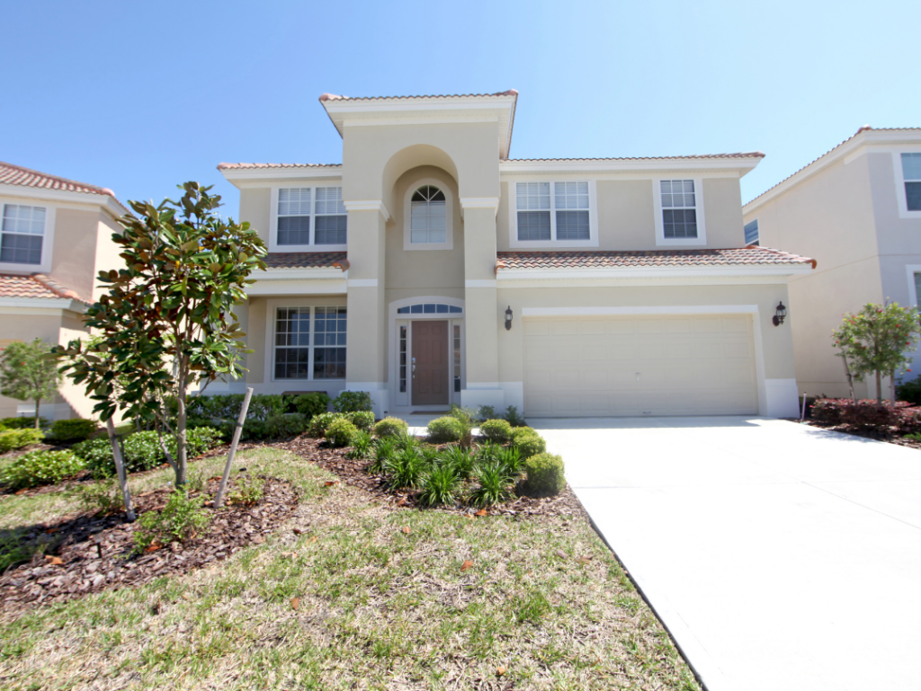 Newly constructed two-story home with a landscaped front yard and driveway